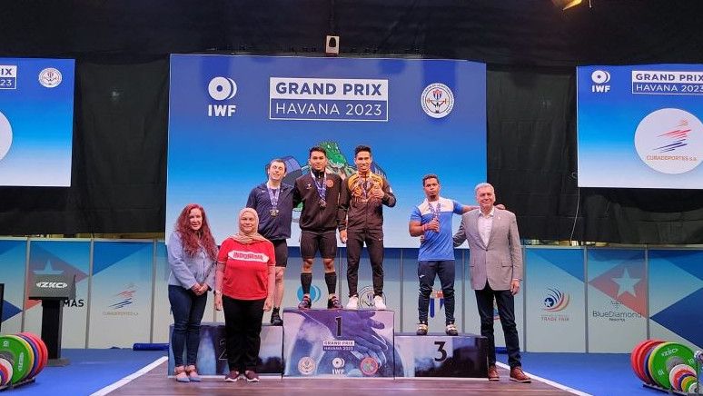 Bangga, Lifter Ricko Saputra Raih Dua Emas pada Grand Prix IWF 2023 di Kuba